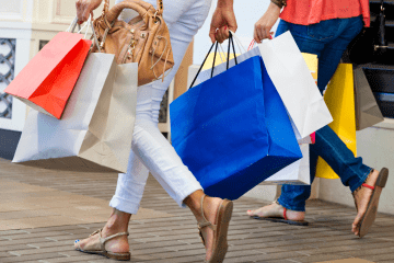 Image of two women walking and shopping for a post covering the best mystery shopping companies.