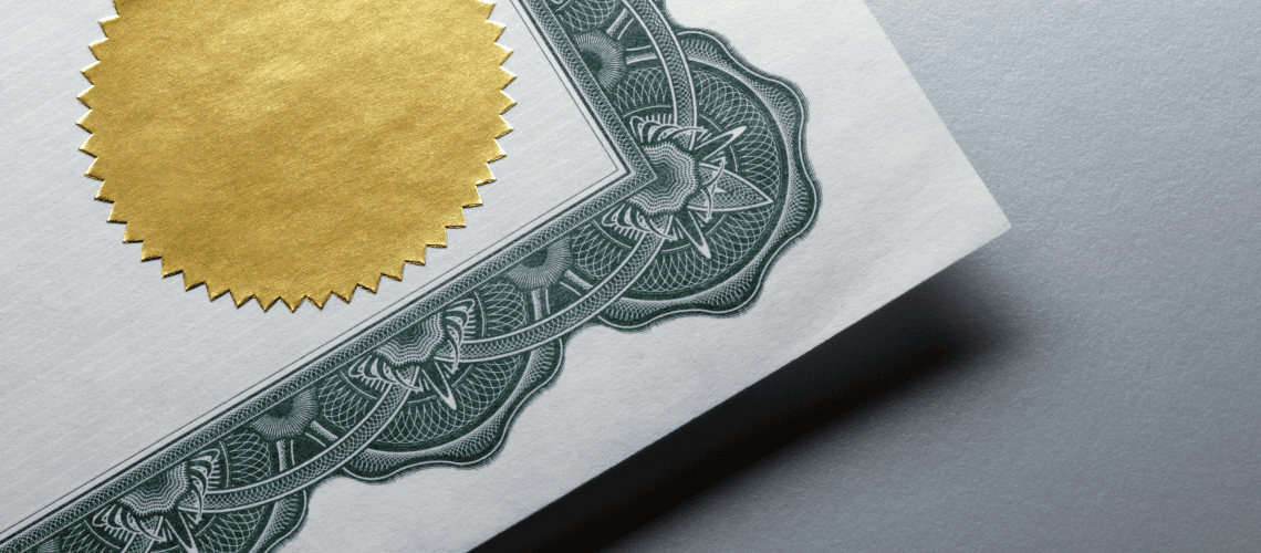 Image of the corner of a certificate over a gray background for a blog post asking "is MSPA certification worth it?"