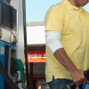 Image of a man pumping gas for his car for a blog post discussing mystery shopping mileage.
