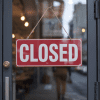 Image of a store with a closed sign on the door for an article covering mystery shopping problems.