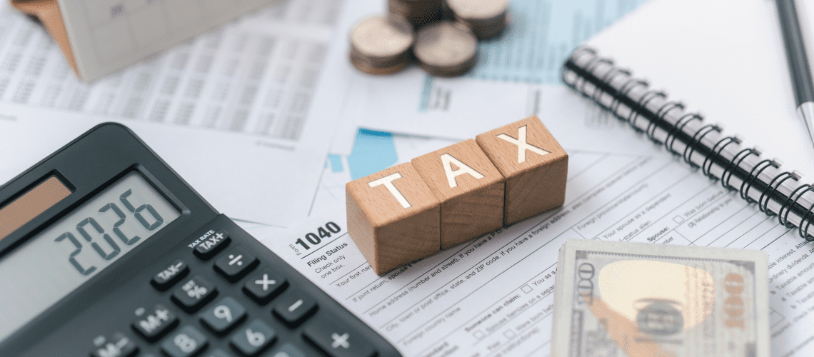 Image of wood block spelling the word "tax" for a blog post covering mystery shopping taxes.