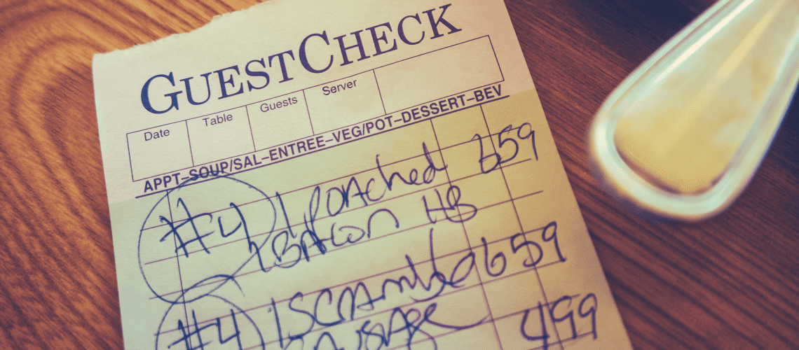 Image of a restaurant check on a table for a blog post covering restaurant mystery shopping.