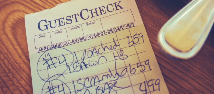 Image of a restaurant check on a table for a blog post covering restaurant mystery shopping.