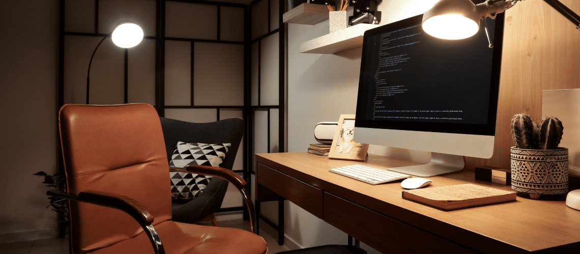 Image of a computer sitting on a desk in a home for a blog post covering the mystery shopping home office deduction.