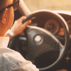 Image of a man driving in his car for an article covering mystery shopping mileage tracking.